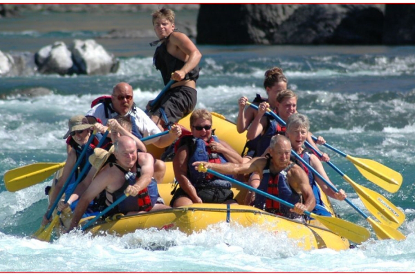 A group of people rafting along the river